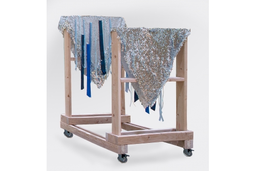 Maria Hupfield, Double Triangles, 2018
Sequin fabric, ribbons, wood structure on wheels
59″ h
Sold
Double Triangles (2018) was made at the Triangle Arts DUMBO Residency and worn by Maria Hupfield and New York–based, long-term collaborator Electric Djinn during The Kind of Dream You’ve Never Seen, a performance in two 25-minute segments in July 2018 at the Brooklyn Museum, New York.
